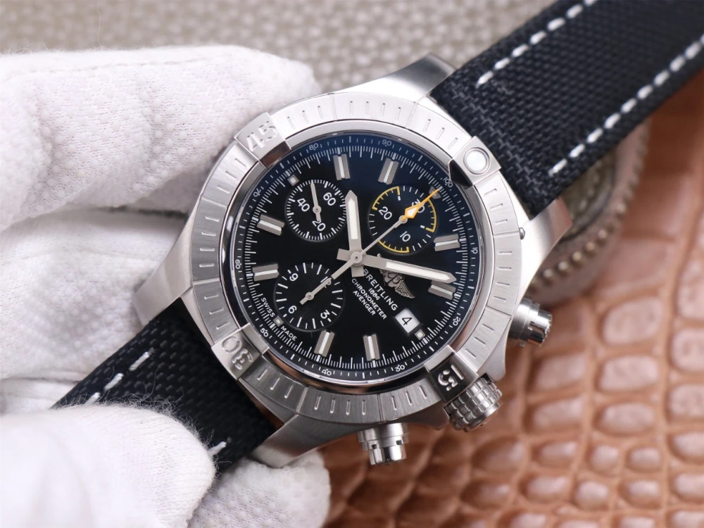 Breitling Avenger Chronograph A13317101B1X1 on black canvas strap, brushed stainless steel bezel, and black dial with applied hour markers left view
