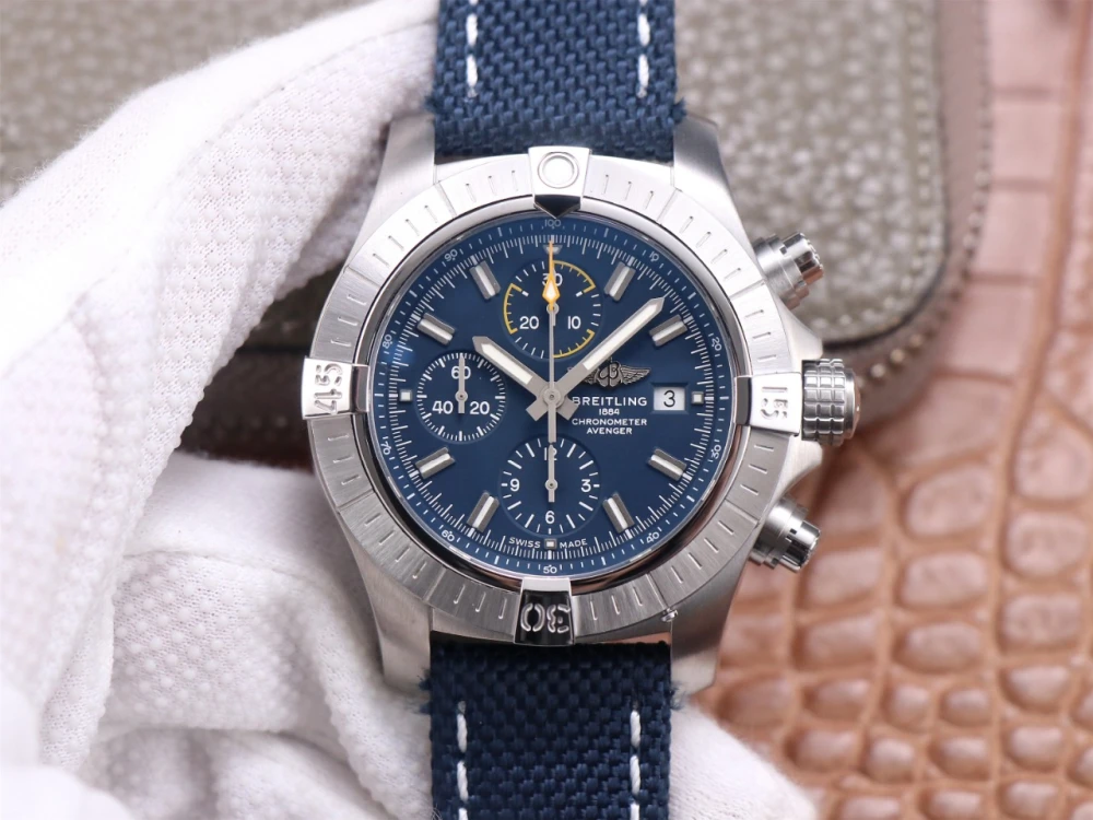 Breitling Avenger Chronograph A13317101C1X1 replica stainless steel case, deep blue dial with yellow-accented 30-minute counter, and navy canvas strap