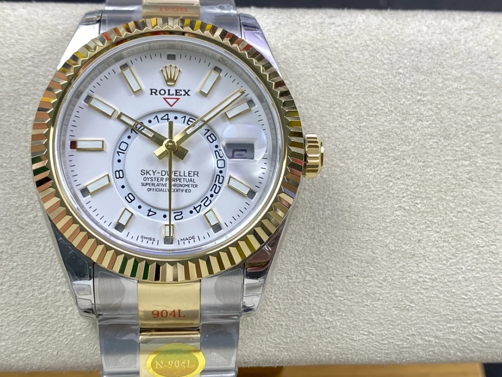 Rolex Sky Dweller two tone 18K yellow gold and stainless steel watch with white dial 42mm case fluted bezel and Oyster bracelet