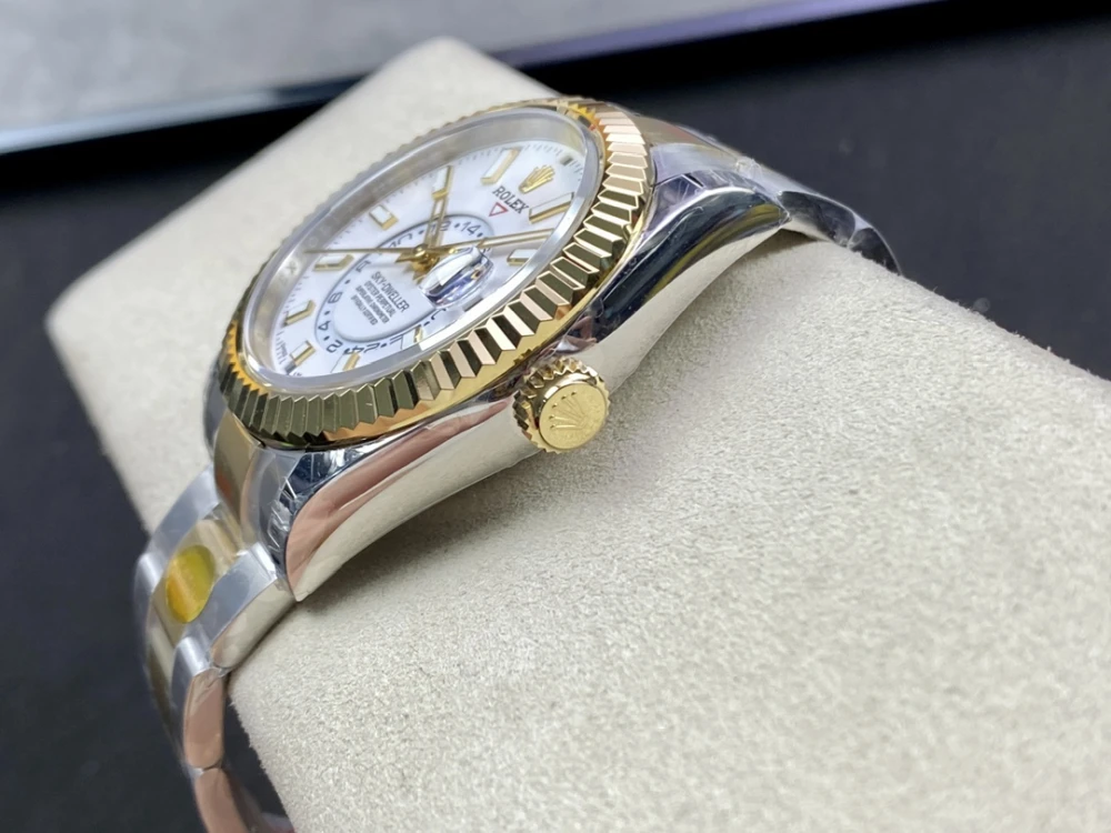 Close up of the Rolex Sky Dweller's 18K yellow gold screw-down crown with the Rolex logo.