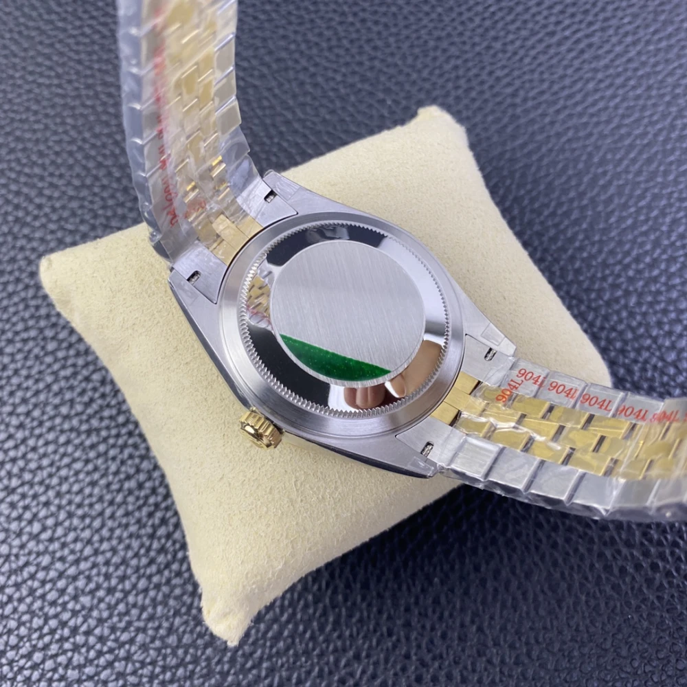  Case back of the Rolex Sky Dweller featuring a stainless steel screw down cover with a green sticker