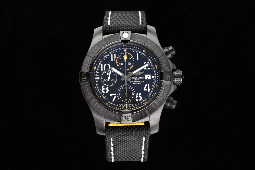 Breitling Avenger Chronograph 45mm black DLC case, dark blue dial, and black canvas strap with white stitching