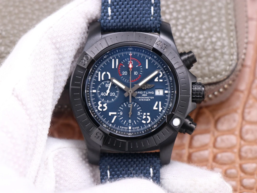 Breitling Avenger Chronograph replica black DLC case, deep blue dial with red-accented 30-minute counter and navy canvas strap with white stitching