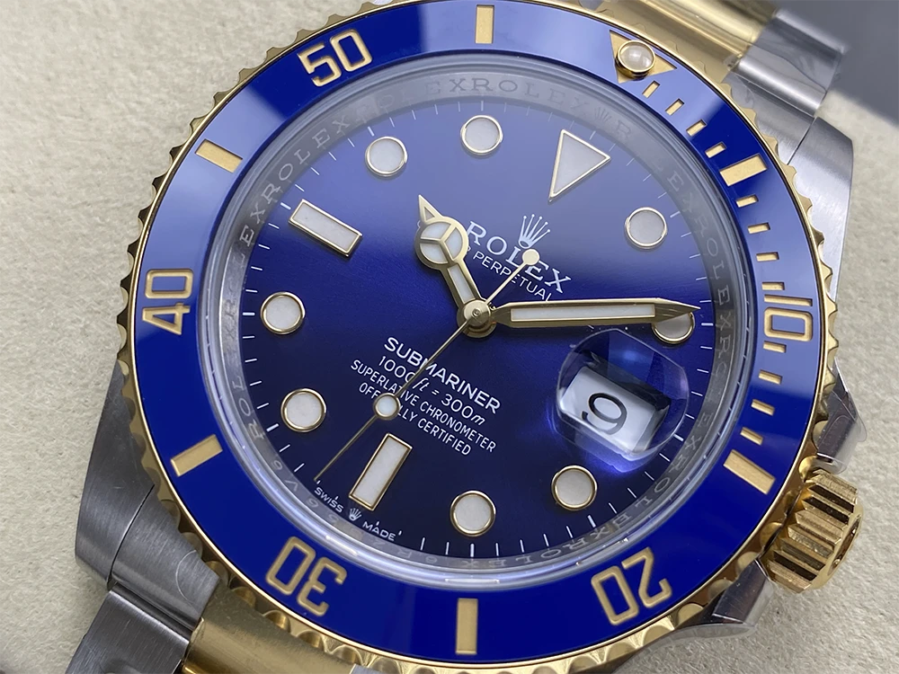 Close up to  ARF Factory 41mm Two-tone Submariner replica, highlighting blue ceramic bezel, gold-plated hands