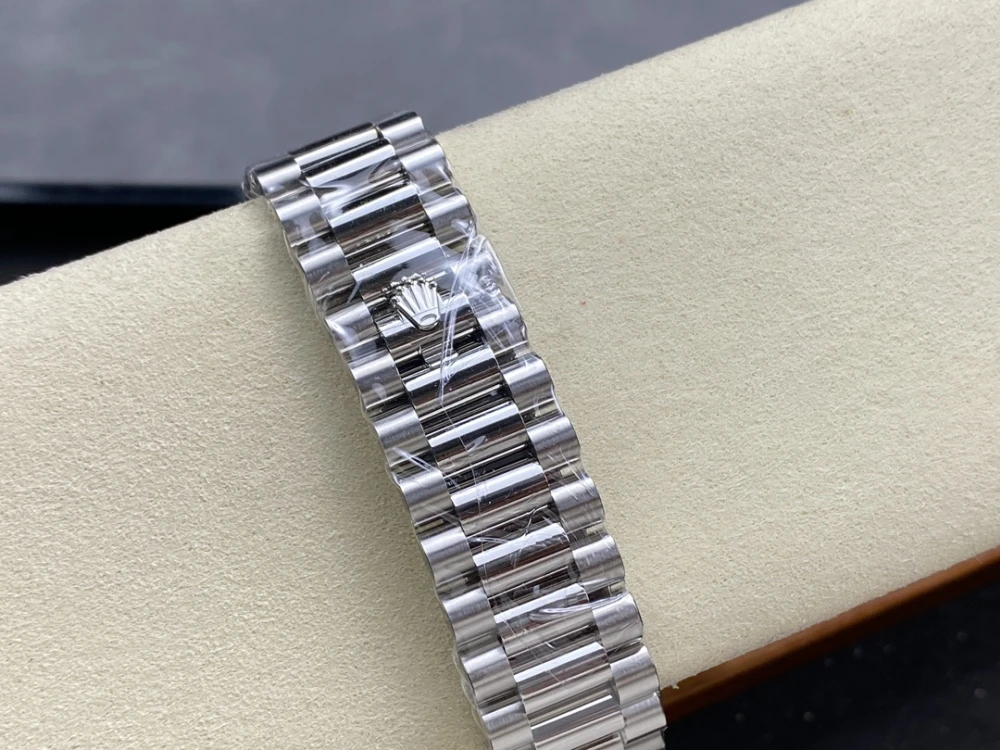 Day-Date 40mm 228236 ARF 1:1 Edition Gradient Blue Roman Dial Fluted Bezel on President Bracelet Asia3255 8 Close-up of Rolex Day-Date 40 President Bracelet Clasp with Crown Logo Polished Stainless Steel Finish